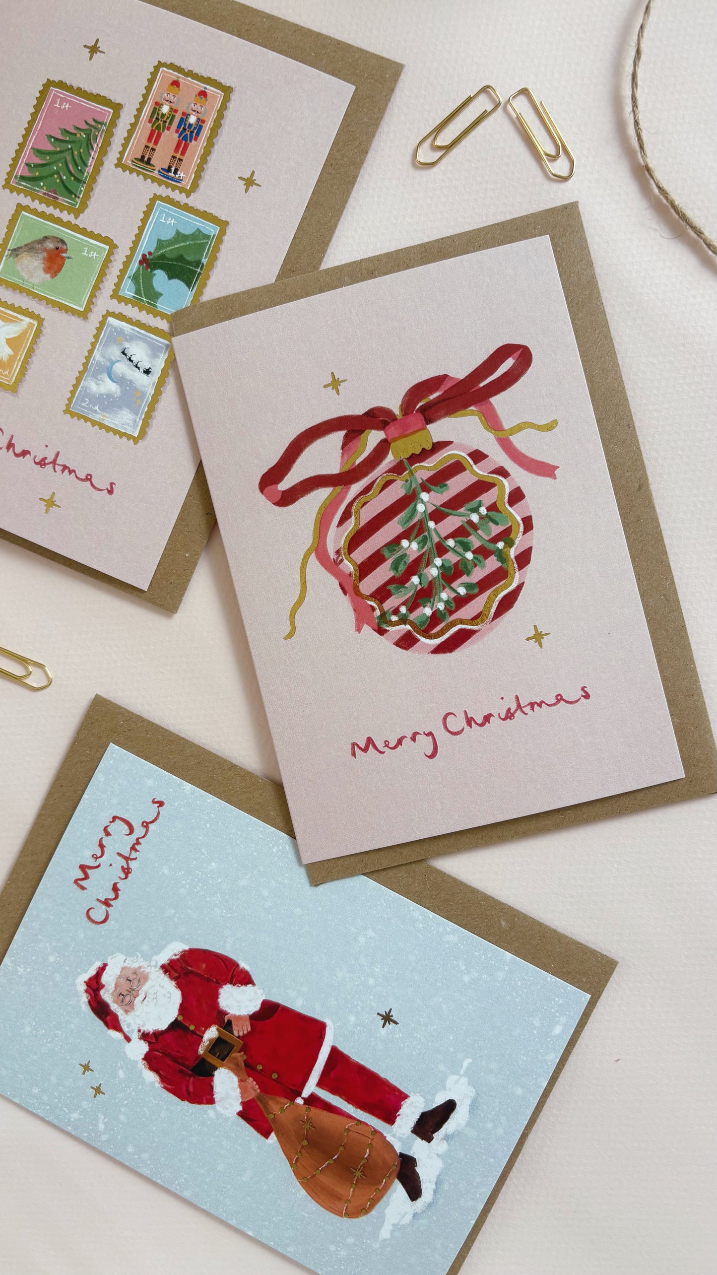 Three Christmas-themed greeting cards with festive designs on a light background.
